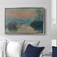 Sunset on the Seine at Lavacourt, Winter Effect, 1880 by Claude Monet displayed above a sofa in a living room in a silver floater frame, featuring a winter scene with warm light reflecting on water at dusk.