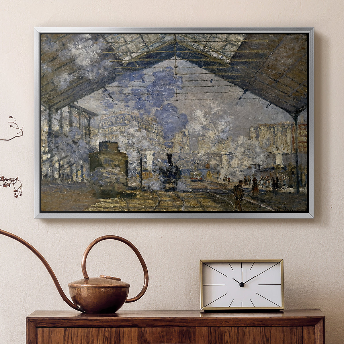 Silver floater framed canvas featuring an industrial interior with steam clouds and rail tracks, displayed above a cabinet in a soft-toned living room.