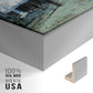 Close-up of the silver floater frame corner and gallery wrapped canvas construction.