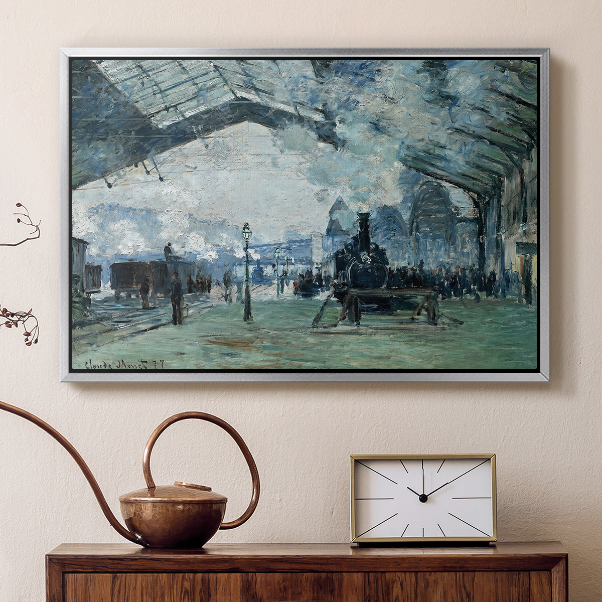 Silver floater framed canvas featuring an interior view of station filled with movement and smoke, displayed above a cabinet in a soft-toned living room.