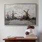 Silver floater framed canvas featuring Windmills near Zaandam, 1871 by Claude Monet above an entryway table in a minimalist foyer.