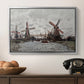 Windmills near Zaandam, 1871 by Claude Monet in a silver floater framed canvas displayed above a console table in a hallway, featuring a landscape featuring windmills and low horizon sky.