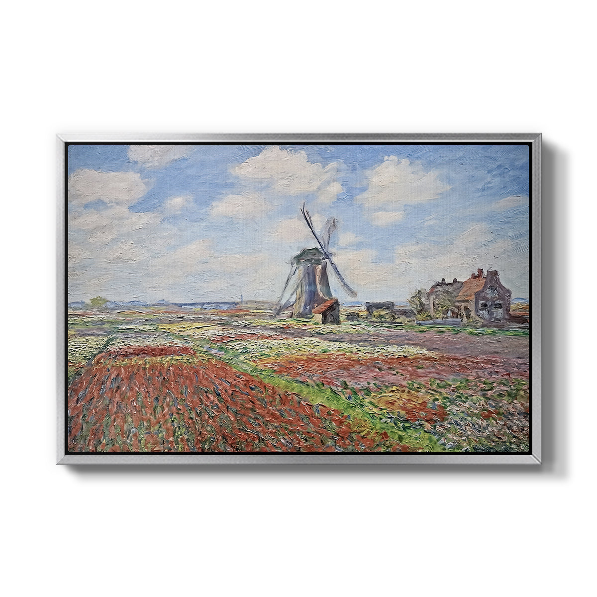 Tulip Fields with the Rijnsburg Windmill, 1886 by Claude Monet in a silver floater framed canvas wall art display.