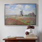 Silver floater framed canvas featuring Tulip Fields with the Rijnsburg Windmill, 1886 by Claude Monet above an entryway table in a minimalist foyer.