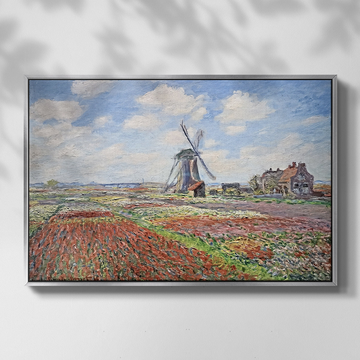 Front view of Tulip Fields with the Rijnsburg Windmill, 1886 by Claude Monet in a silver floater framed canvas.