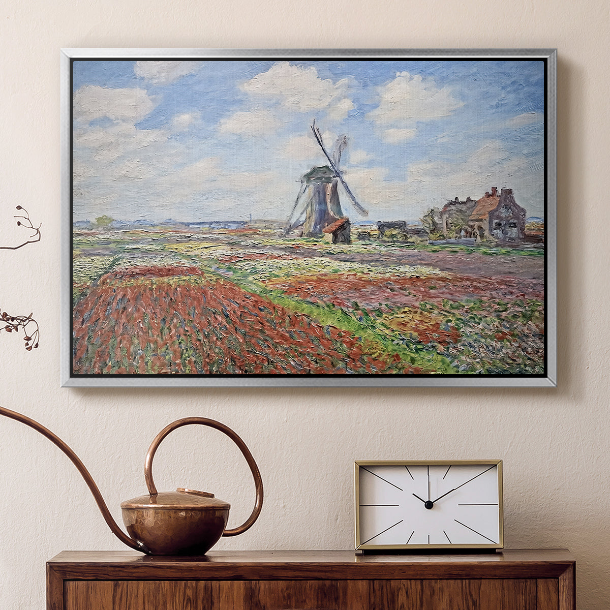 Silver floater framed canvas featuring an impressionist field of blooming tulips under bright sky, displayed above a cabinet in a soft-toned living room.