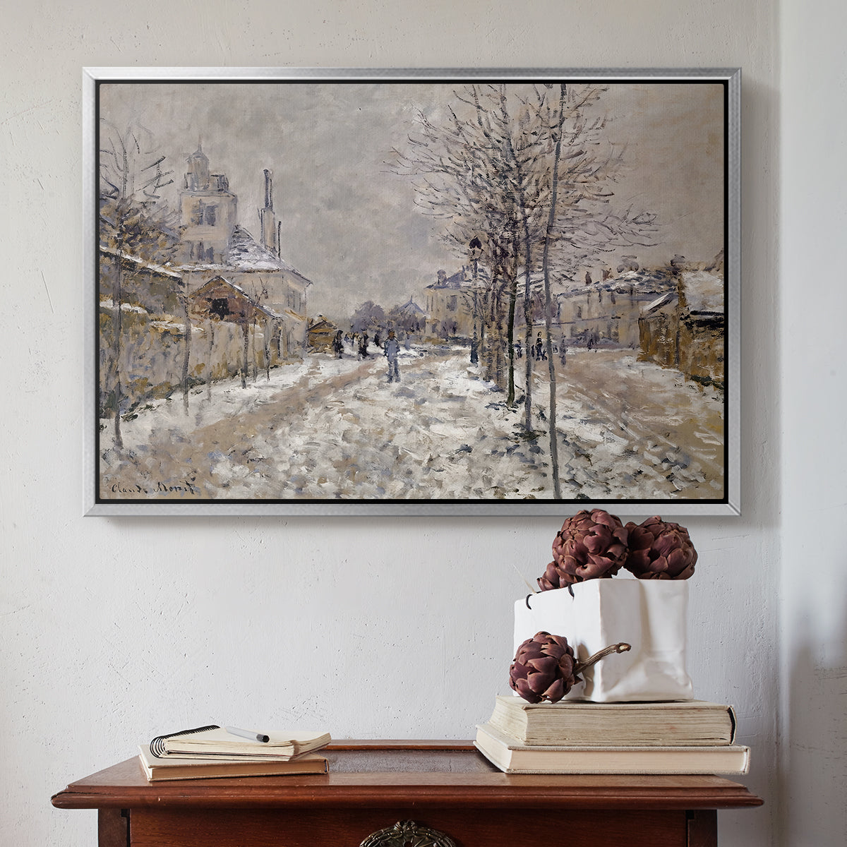 Silver floater framed canvas featuring The Boulevard de Pontoise at Argenteuil, Snow Effect, 1875 by Claude Monet above an entryway table in a minimalist foyer.