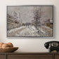 The Boulevard de Pontoise at Argenteuil, Snow Effect, 1875 by Claude Monet in a silver floater framed canvas displayed above a console table in a hallway, featuring an urban winter landscape with muted tones and soft light.