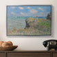 The Cliff Walk at Pourville, 1882 by Claude Monet in a silver floater framed canvas displayed above a console table in a hallway, featuring an elevated shoreline path with figures and bright sky.