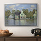 Houses on the Zaan River at Zaandam, 1871 by Claude Monet in a silver floater framed canvas displayed above a console table in a hallway, featuring a waterfront architecture with still reflections.