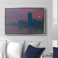 The Houses of Parliament, Sunset, 1903 by Claude Monet displayed above a sofa in a living room in a silver floater frame, featuring an impressionist cityscape with warm sunset light over water.