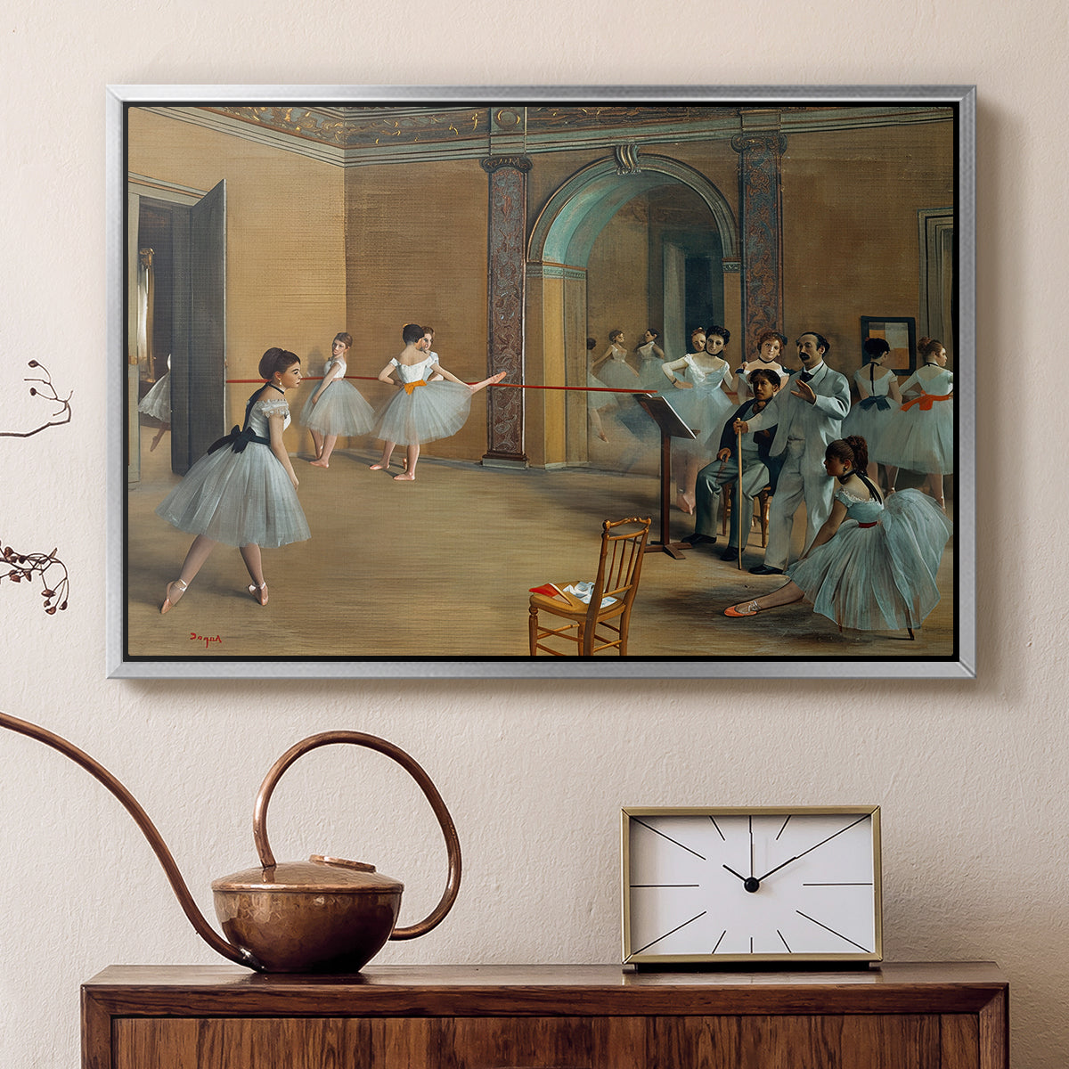 Silver floater framed canvas featuring an impressionist depiction of ballet foyer with multiple figures, displayed above a cabinet in a soft-toned living room.