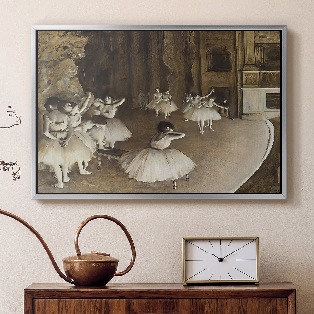Silver floater framed canvas featuring an impressionist depiction of ballet practice on theater stage, displayed above a cabinet in a soft-toned living room.