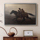 Silver floater framed canvas featuring a narrative painting of escape and urgency across rugged terrain, displayed above a cabinet in a soft-toned living room.