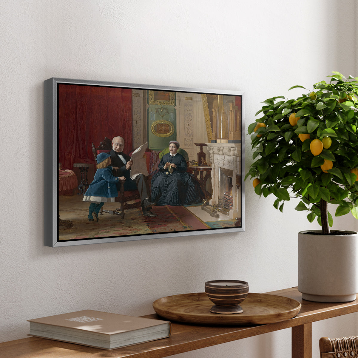 The Brown Family, 1869 by Eastman Johnson, presented in a silver floater framed canvas featuring a family seated together in interior room engaged in quiet activity, displayed above a hallway console table.