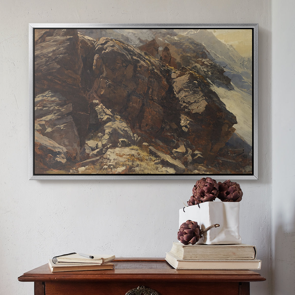 Silver floater framed canvas featuring High Mountain Study, c. 1870 by Edward Theodore Compton above an entryway table in a minimalist foyer.