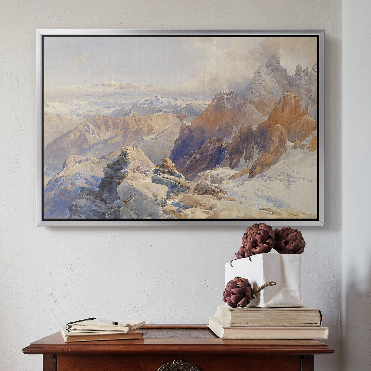 Silver floater framed canvas featuring Col du Géant, 1903 by Edward Theodore Compton above an entryway table in a minimalist foyer.