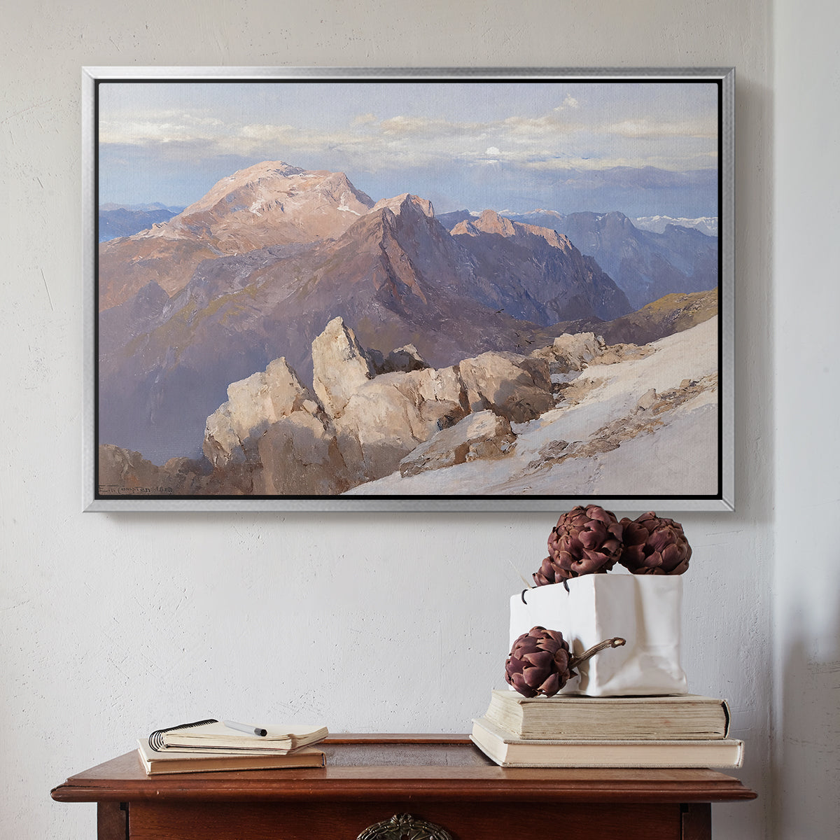 Silver floater framed canvas featuring Hoher Göll from Watzmann-Hocheck, 1919 by Edward Theodore Compton above an entryway table in a minimalist foyer.