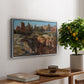 Palatine in Rome, c. 1921 by Edward Theodore Compton, presented in a silver floater framed canvas featuring historic Roman ruins and buildings set within warm landscape, displayed above a hallway console table.