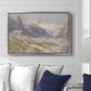 Shepherds (Pasterze), c. 1921 by Edward Theodore Compton displayed above a sofa in a living room in a silver floater frame, featuring a pastoral mountain scene with figures tending livestock.