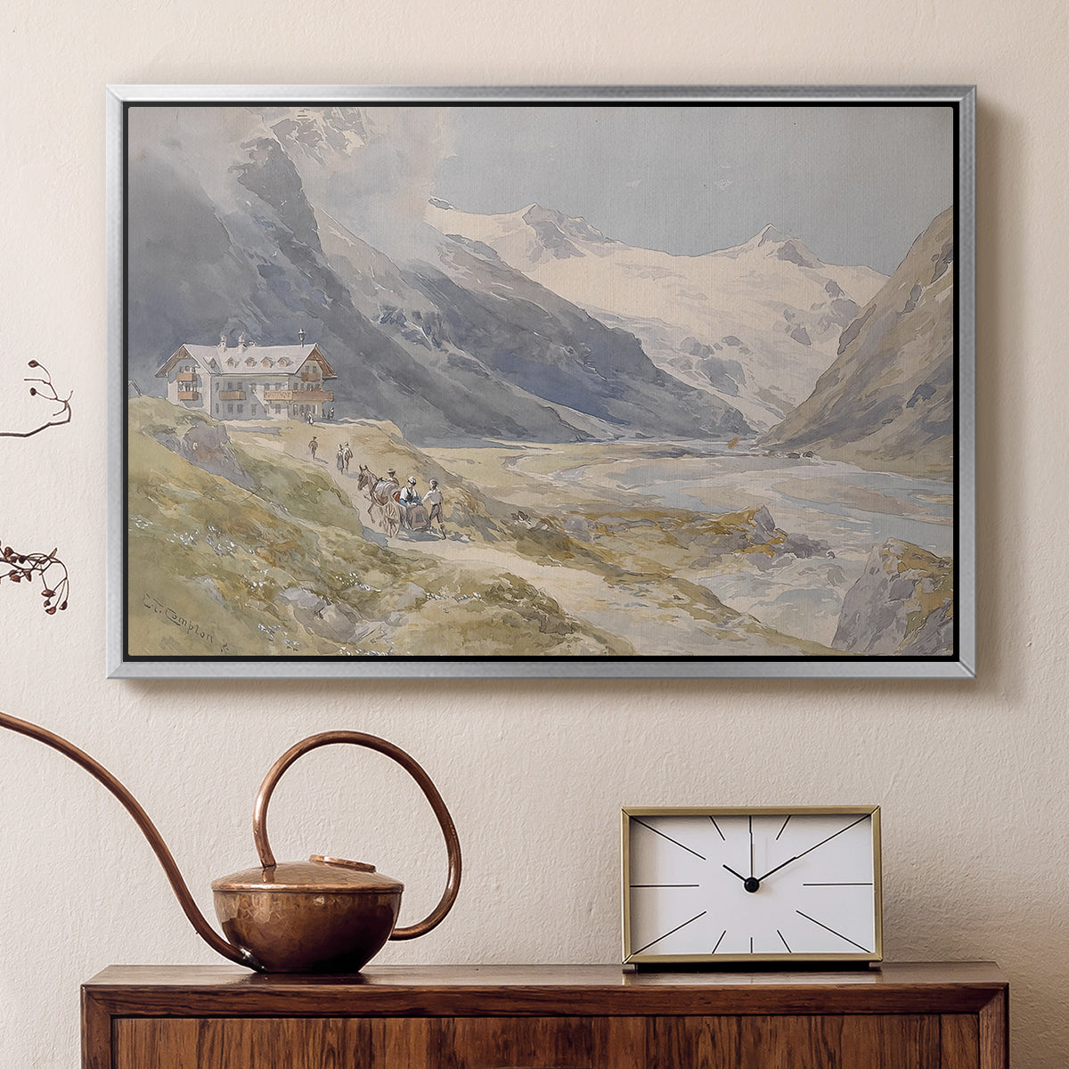 Silver floater framed canvas featuring a rural alpine setting with shepherds and open terrain, displayed above a cabinet in a soft-toned living room.
