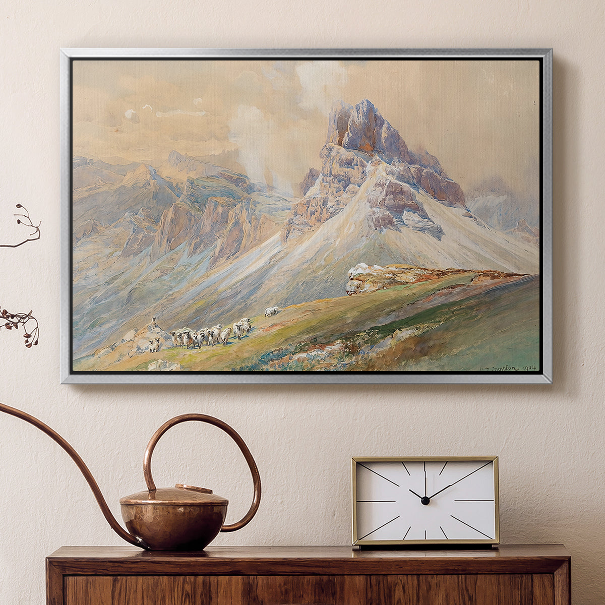 Silver floater framed canvas featuring an expansive landscape featuring iconic Dolomite peaks, displayed above a cabinet in a soft-toned living room.