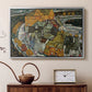 Silver floater framed canvas featuring an expressionist depiction of island town with geometric forms, displayed above a cabinet in a soft-toned living room.