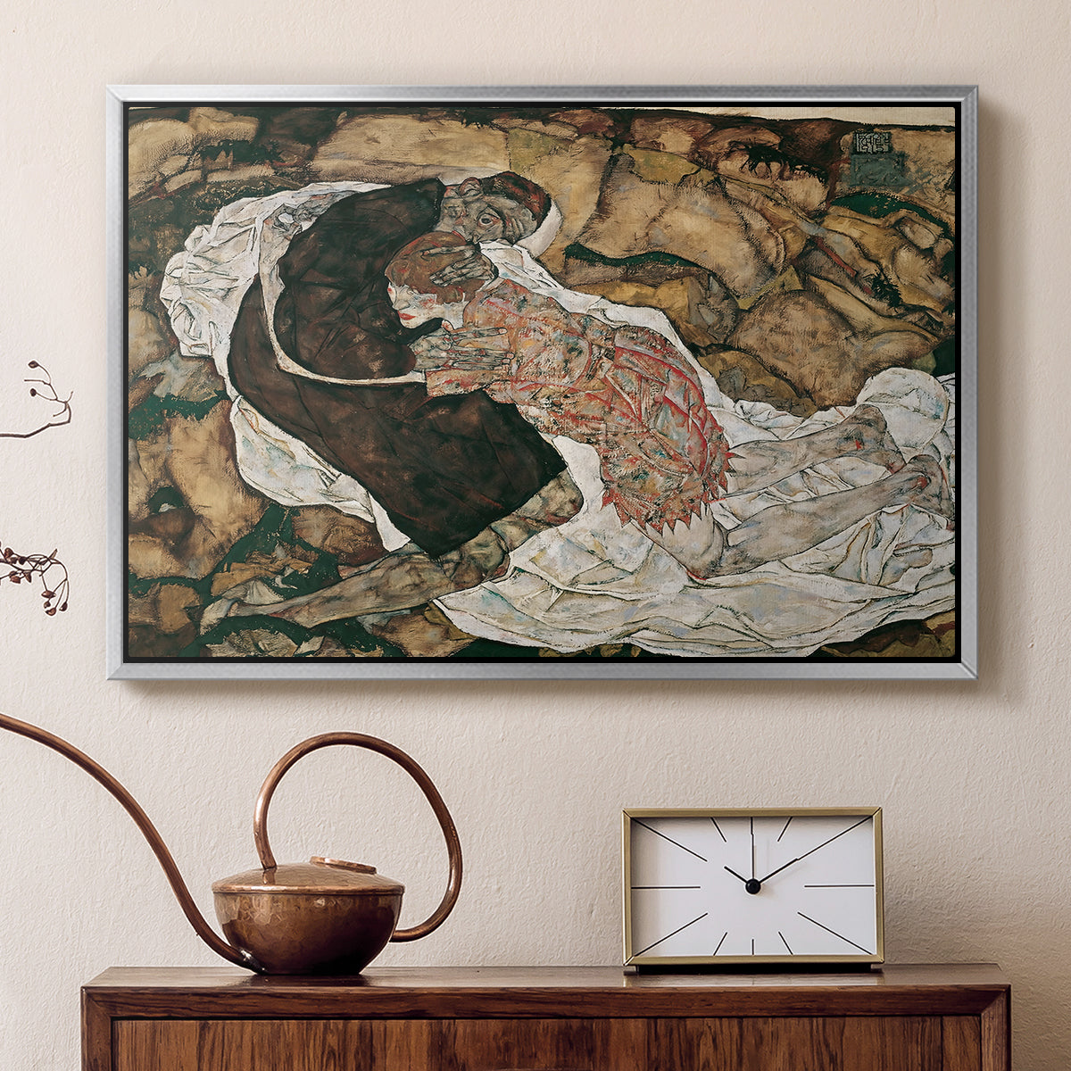 Silver floater framed canvas featuring an expressionist painting of human figures in dramatic pose, displayed above a cabinet in a soft-toned living room.