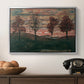 Four Trees, 1917 by Egon Schiele in a silver floater framed canvas displayed above a console table in a hallway, featuring an expressionist landscape featuring isolated trees in field.