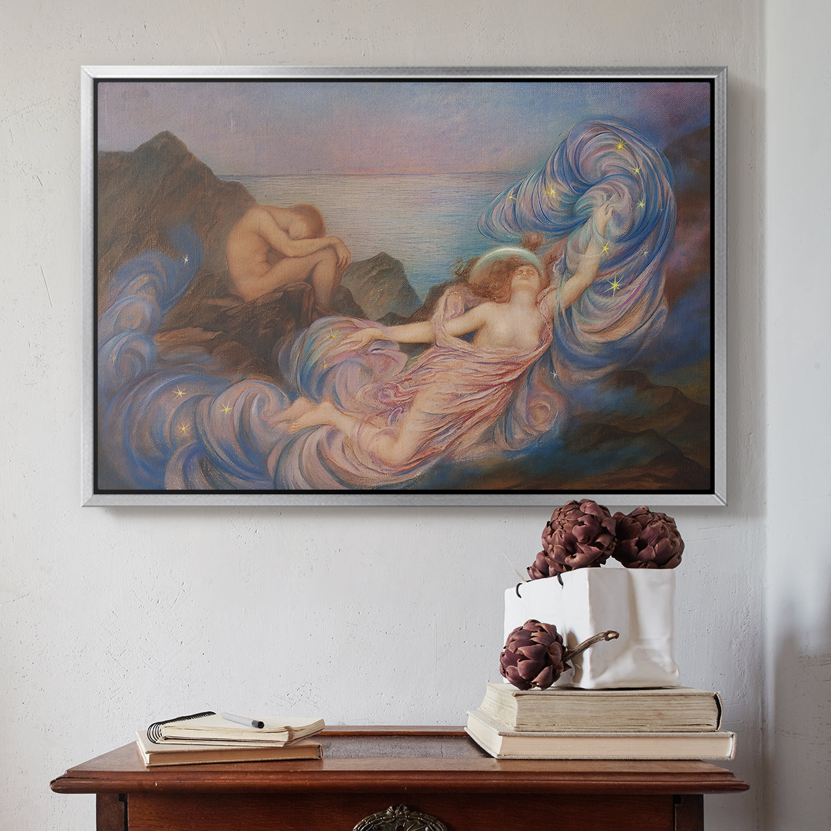 Silver floater framed canvas featuring Twilight, 1914 by Evelyn De Morgan above an entryway table in a minimalist foyer.