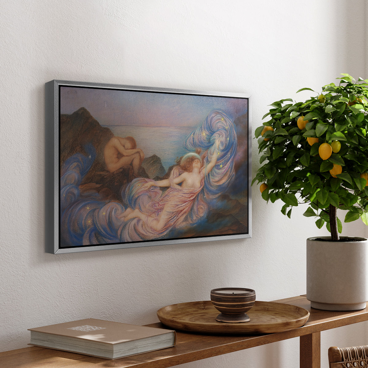 Twilight, 1914 by Evelyn De Morgan, presented in a silver floater framed canvas featuring a reclining female figure beneath glowing sky at twilight with soft colors, displayed above a hallway console table.