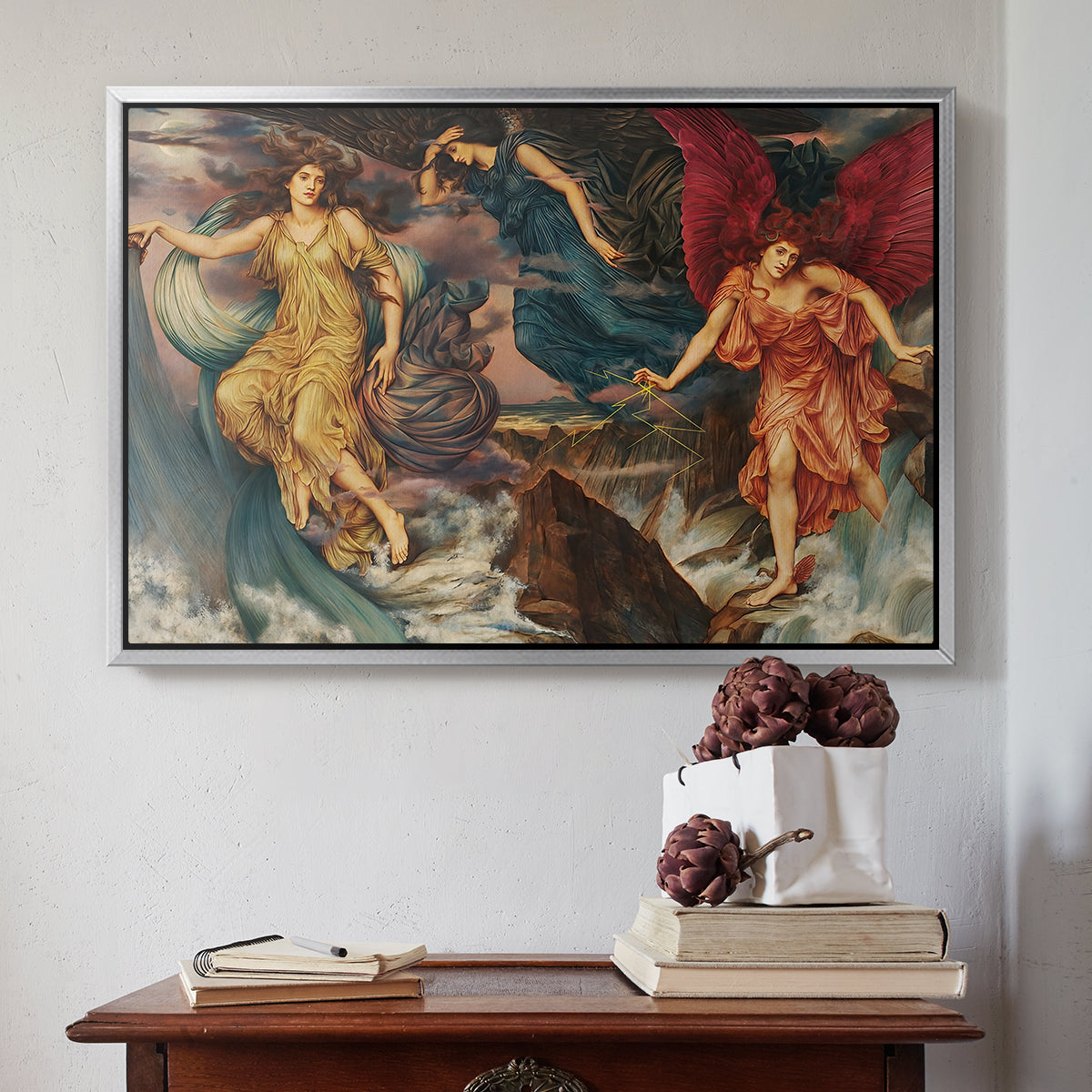 Silver floater framed canvas featuring The Storm Spirits, 1900 by Evelyn De Morgan above an entryway table in a minimalist foyer.