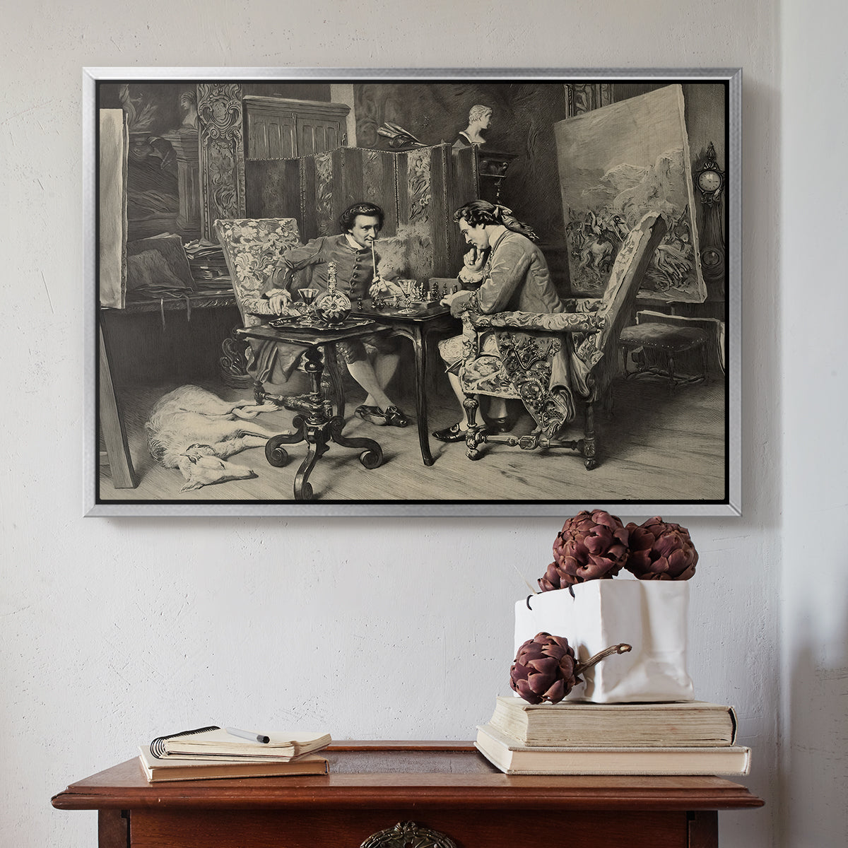 Silver floater framed canvas featuring The Chess Players, 1858 by Ernest Meissonier above an entryway table in a minimalist foyer.