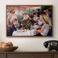 Luncheon of the Boating Party (Le Déjeuner des canotiers), 1880-1881 by Pierre-Auguste Renoir in a walnut floater framed canvas displayed above a console table in a hallway, featuring a social dining scene with figures seated around table on riverside terrace.