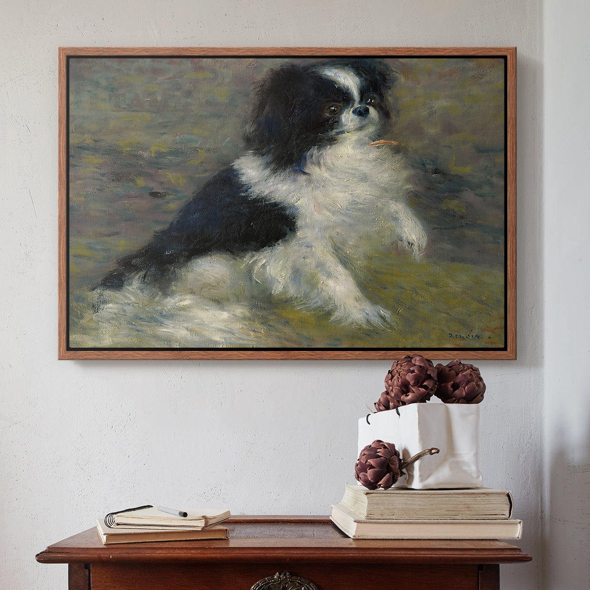 Walnut floater framed canvas featuring Tama, the Japanese Dog, c. 1876 by Pierre-Auguste Renoir above an entryway table in a minimalist foyer.