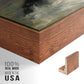 Close-up of the walnut floater frame corner and gallery wrapped canvas construction.
