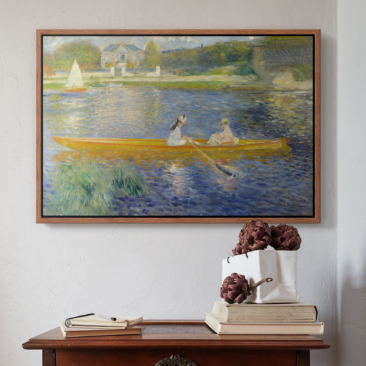 Walnut floater framed canvas featuring The Skiff (La Yole), 1875 by Pierre-Auguste Renoir above an entryway table in a minimalist foyer.