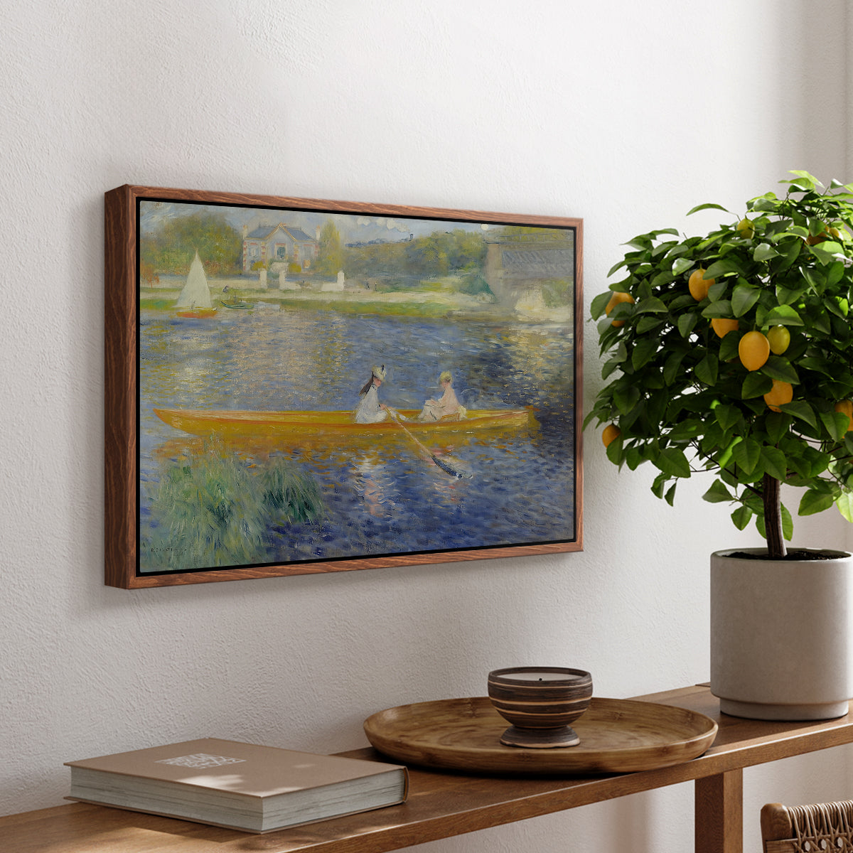 The Skiff (La Yole), 1875 by Pierre-Auguste Renoir, presented in a walnut floater framed canvas featuring two figures seated in a small boat drifting across calm water, displayed above a hallway console table.