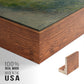 Close-up of the walnut floater frame corner and gallery wrapped canvas construction.