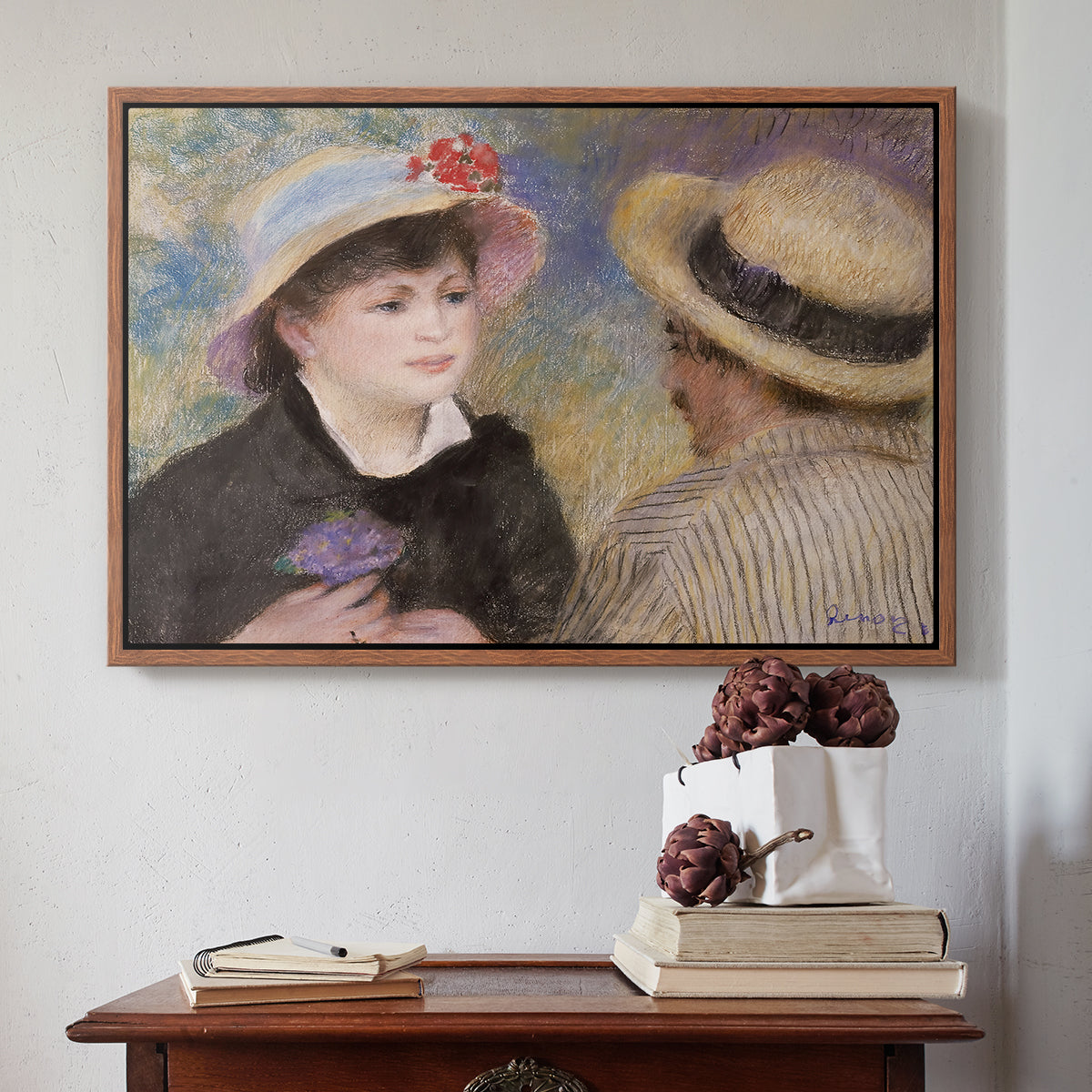 Walnut floater framed canvas featuring Boating Couple (Aline Charigot and Renoir), c. 1881 by Pierre-Auguste Renoir above an entryway table in a minimalist foyer.