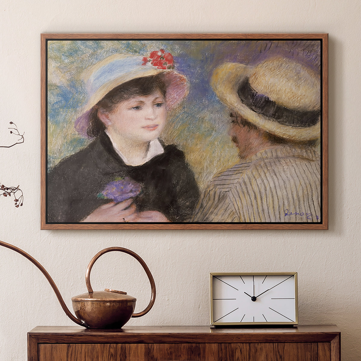 Walnut floater framed canvas featuring an impressionist depiction of couple enjoying leisure time near water, displayed above a cabinet in a soft-toned living room.