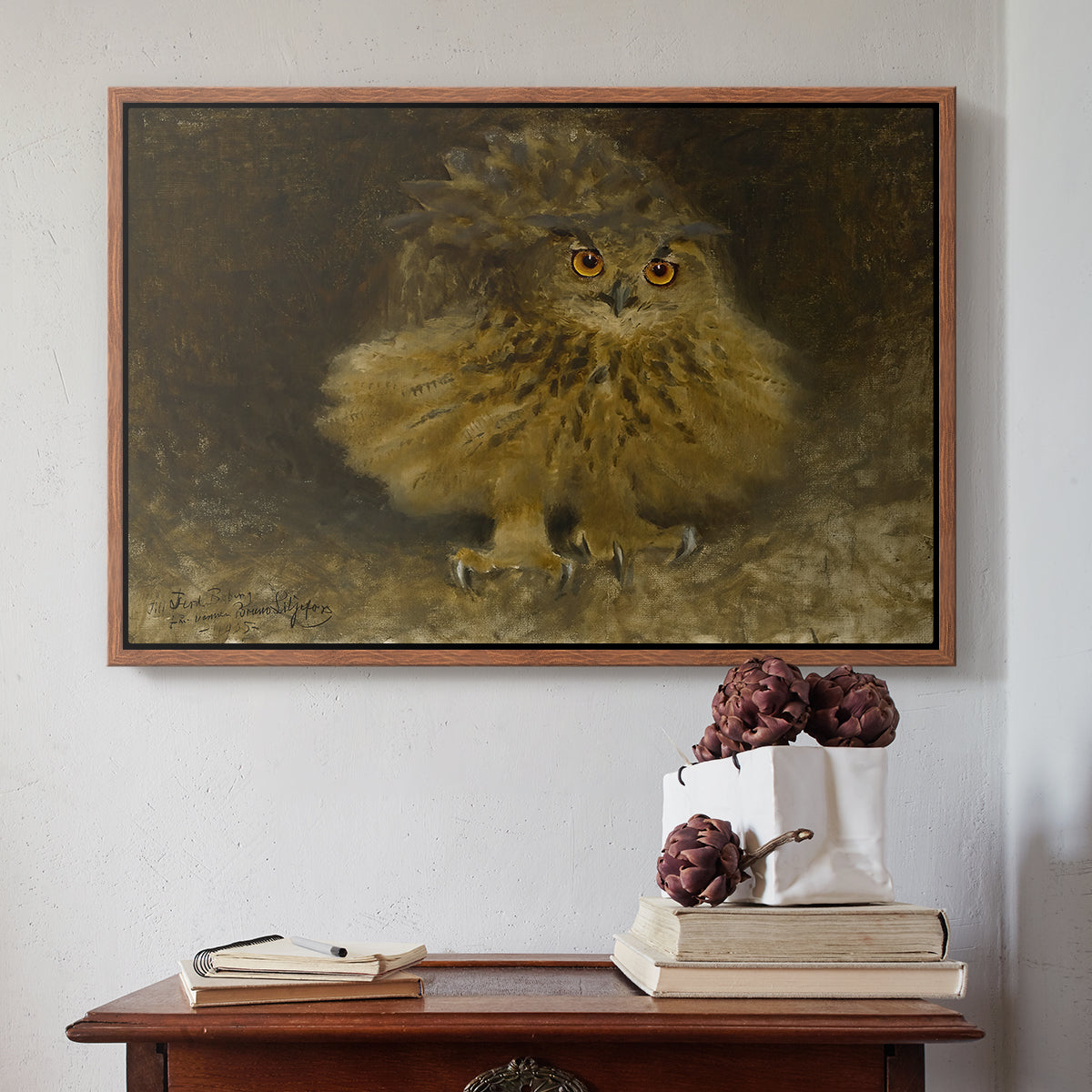 Walnut floater framed canvas featuring An Eagle Owl (Berguv), 1905 by Bruno Liljefors above an entryway table in a minimalist foyer.