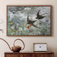 Walnut floater framed canvas featuring a multiple birds flying together in natural outdoor scene, displayed above a cabinet in a soft-toned living room.
