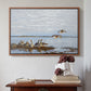 Walnut floater framed canvas featuring Greylag Geese (Grågäss), 1922 by Bruno Liljefors above an entryway table in a minimalist foyer.