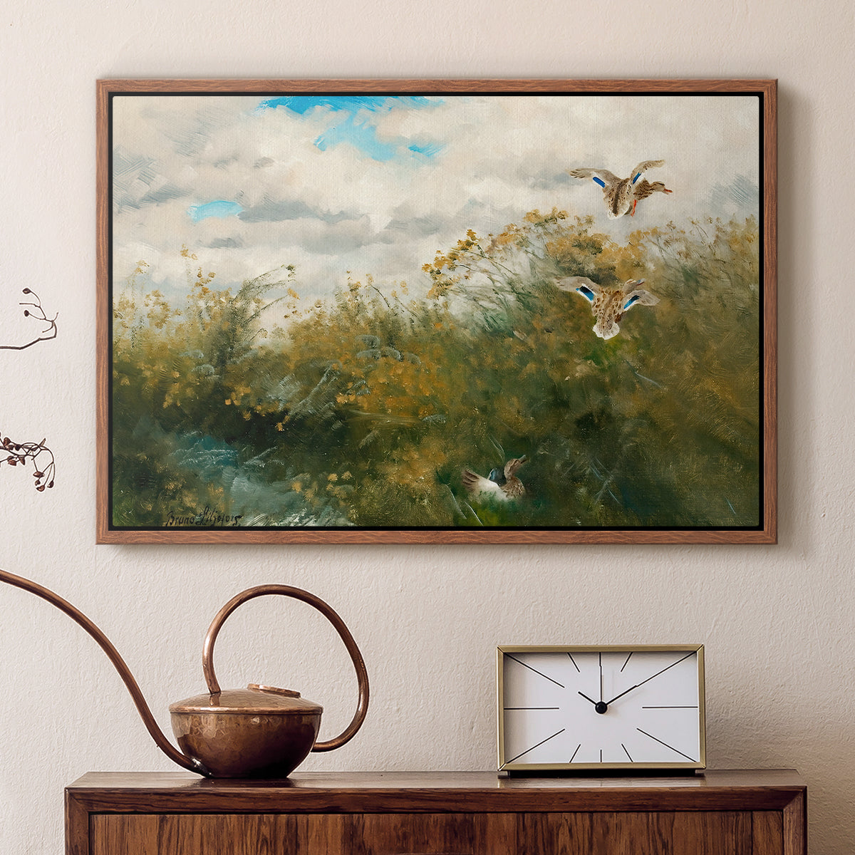Walnut floater framed canvas featuring a group of ducks foraging in natural marsh setting, displayed above a cabinet in a soft-toned living room.
