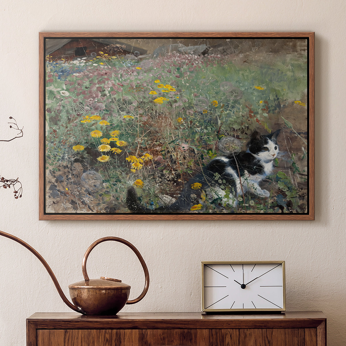 Walnut floater framed canvas featuring an animal scene of cat hidden in lush meadow vegetation, displayed above a cabinet in a soft-toned living room.