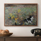 Cat on a Flowery Meadow, 1887 by Bruno Liljefors in a walnut floater framed canvas displayed above a console table in a hallway, featuring a naturalistic depiction of cat in blooming countryside setting.