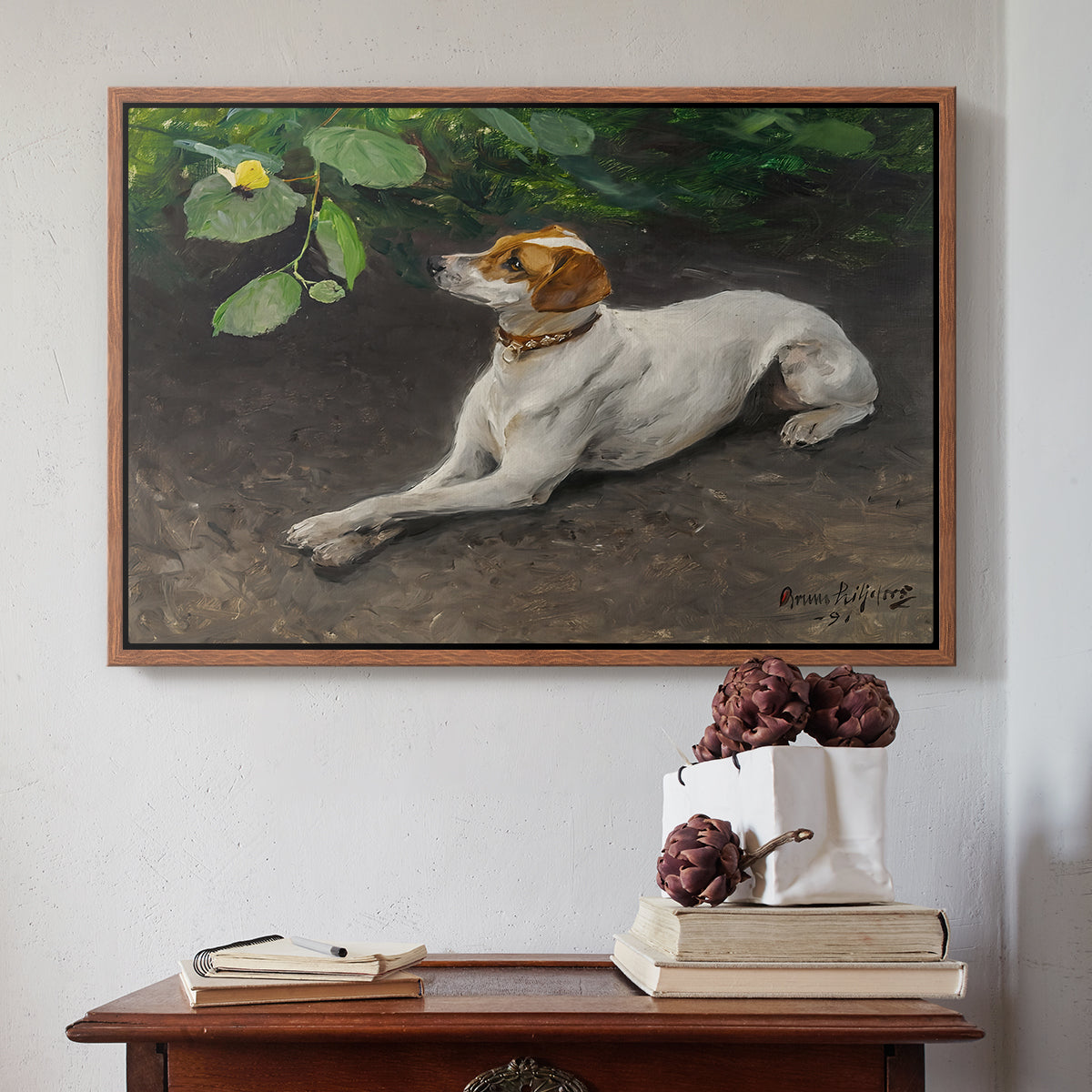 Walnut floater framed canvas featuring Portrait of a Dog, 1891 by Bruno Liljefors above an entryway table in a minimalist foyer.