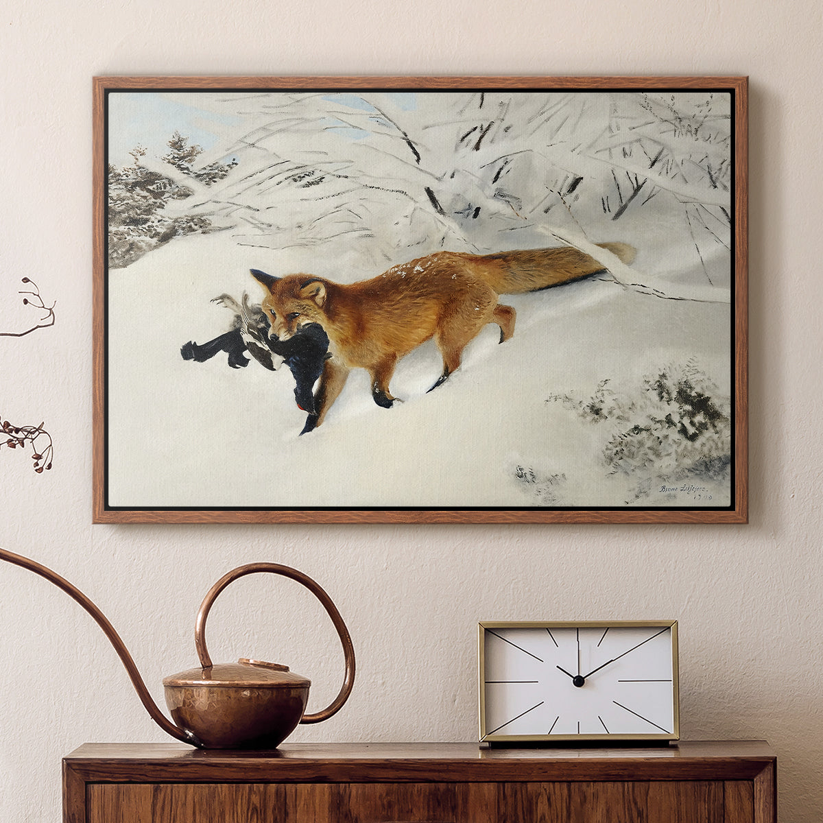 Walnut floater framed canvas featuring a red fox crossing snow-covered ground under pale sky, displayed above a cabinet in a soft-toned living room.