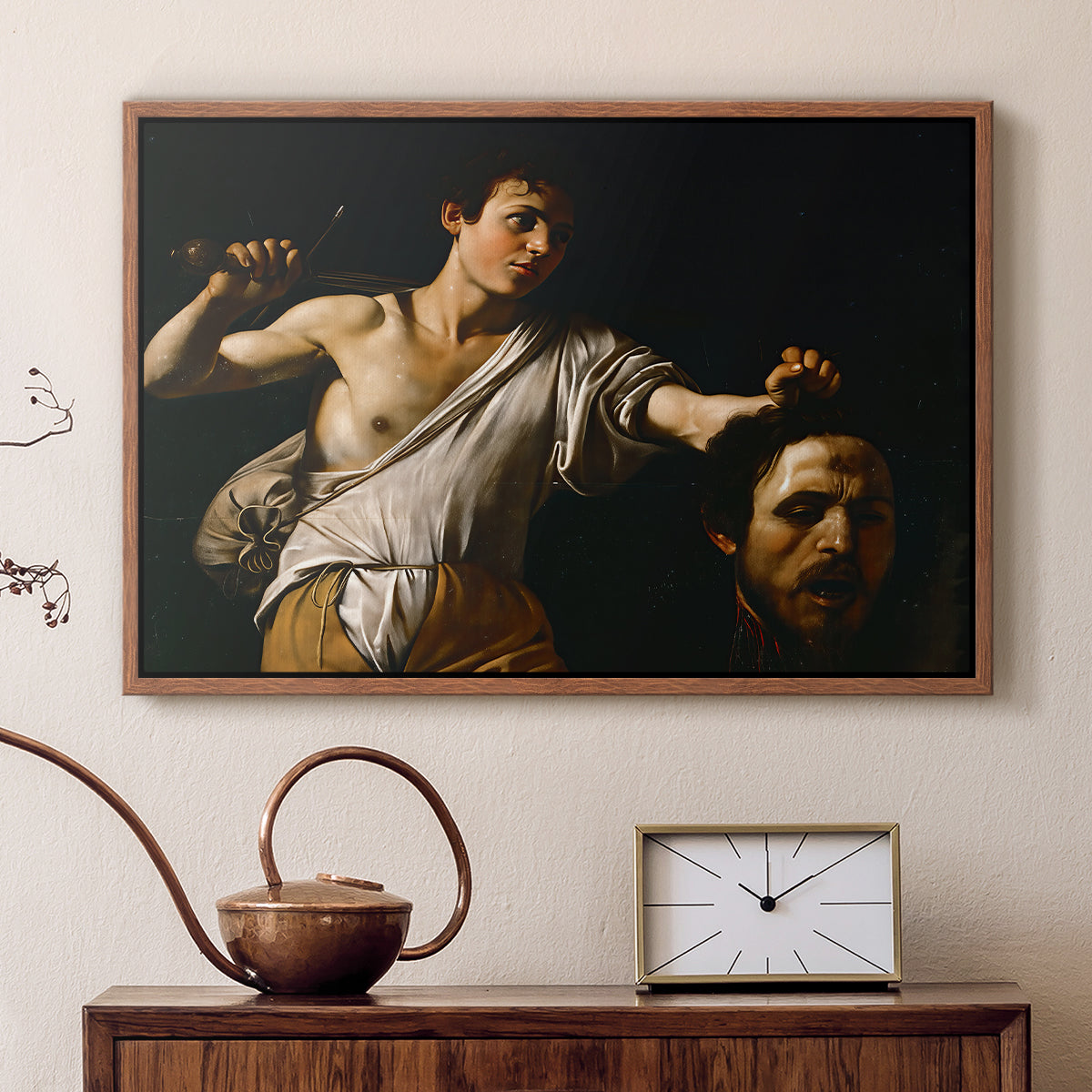 Walnut floater framed canvas featuring a Baroque depiction of youth holding severed head in shadowy setting, displayed above a cabinet in a soft-toned living room.